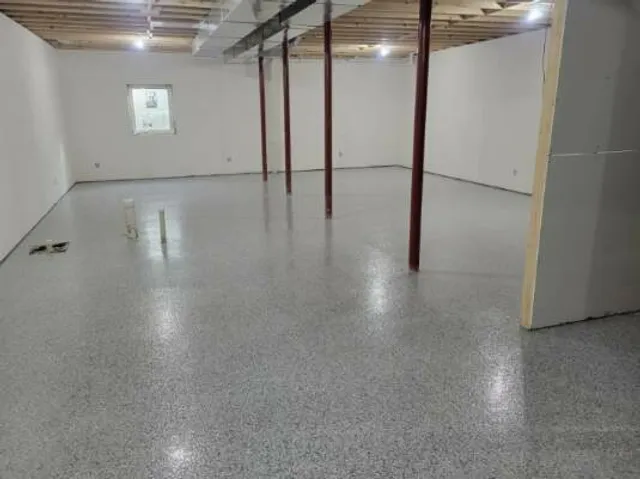 Epoxy flake floor installed in a finished basement