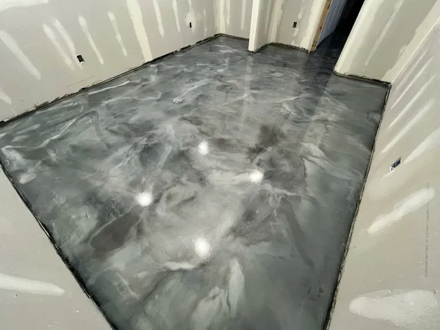 Titanium gray metallic epoxy floor with a marbled finish